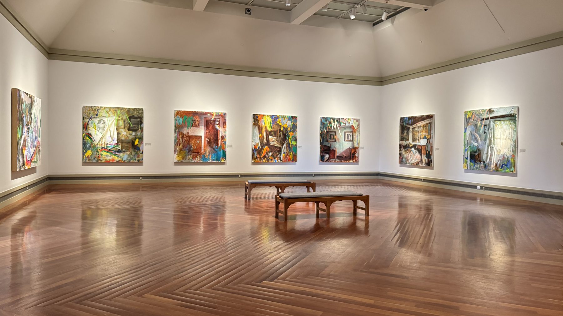 Damian Stamer's Angels & Ghosts paintings installed in a gallery at the Middlebury College Museum of Art.